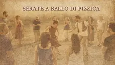 Gruppo di danzatori su palco in luce calda